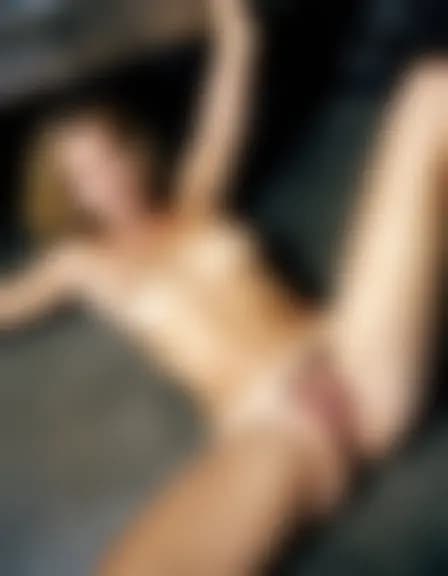 Natalie and a partner in a dark garage, missionary position on a concrete floor near a workbench.