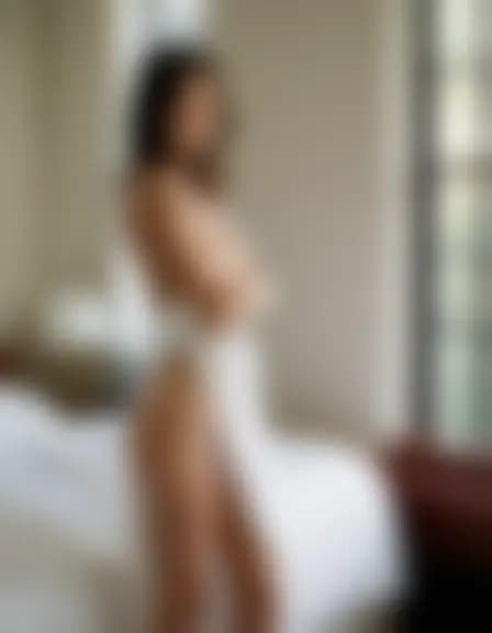 Chloe in a minimalist dorm room, intimate moment.