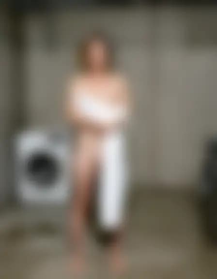 Zoe in a basement laundry room; harsh fluorescent lights.