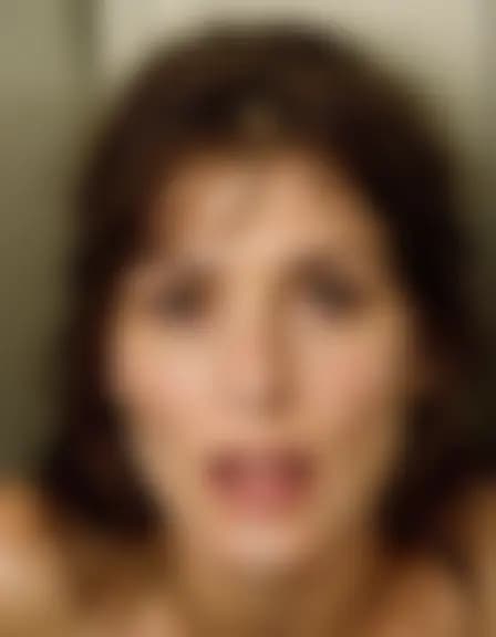 Lillian's facial cumshot in a cramped, fluorescent-lit utility closet.