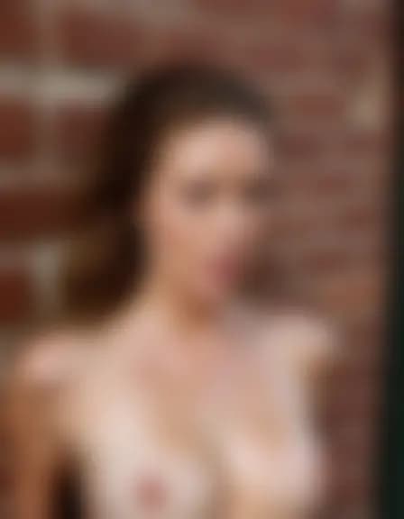 Olivia in a cumshot facial in a shadowy alley behind a coffee shop.