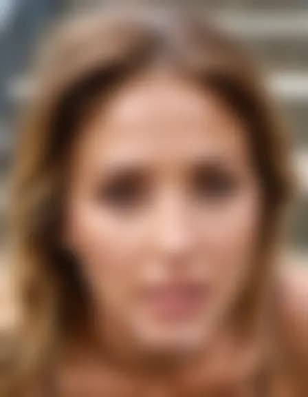 Ella in a cumshot facial on concrete stairs.