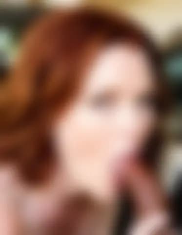 Evelyn receiving a blowjob in a luxury car parked in an apartment complex.