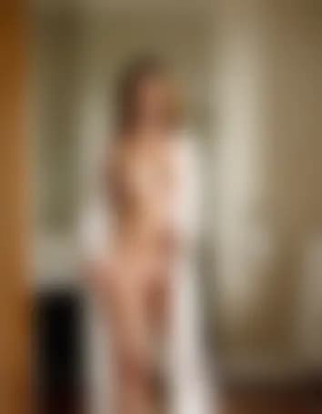 Olivia in a stylish apartment, suggestive intimacy.